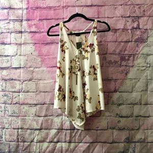 cream colored tank top with roses